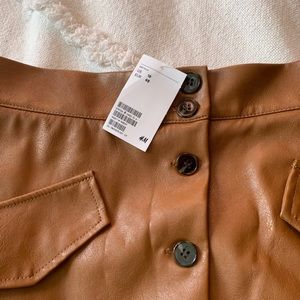 H&M faux leather skirt. Never worn out! Size 16.